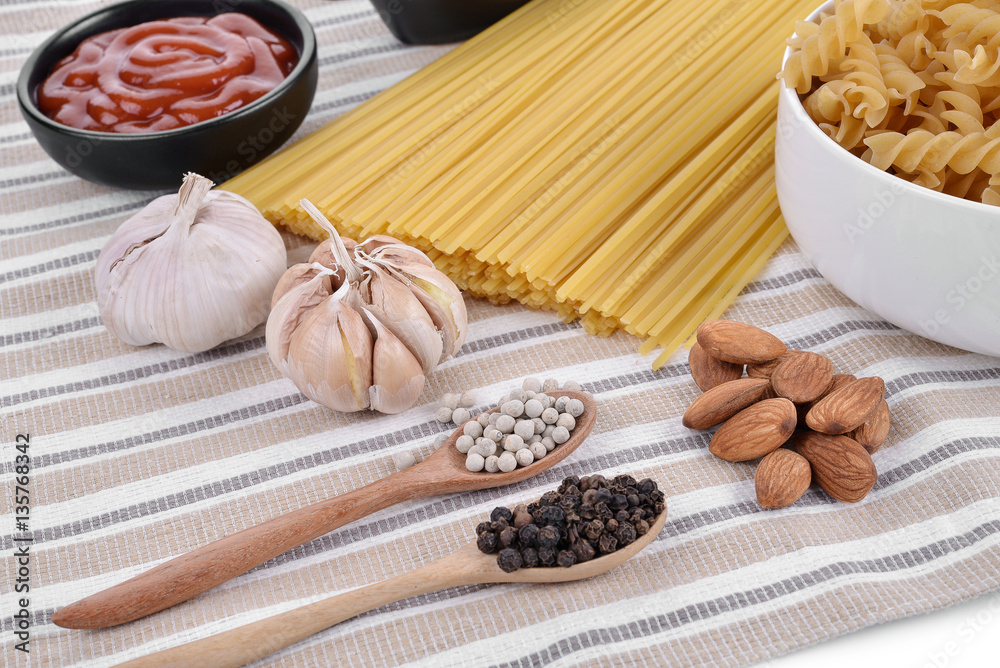 Pasta spaghetti with tomatoes ; pepper ,garlic  background.