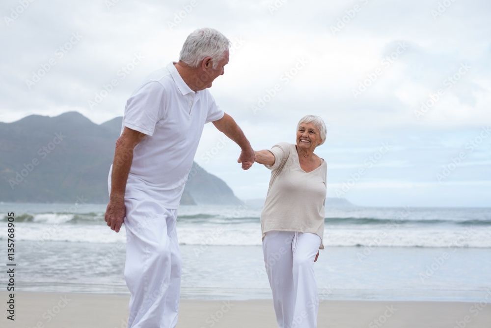 Senior couple having fun together at beach Senior couple having fun together at beach