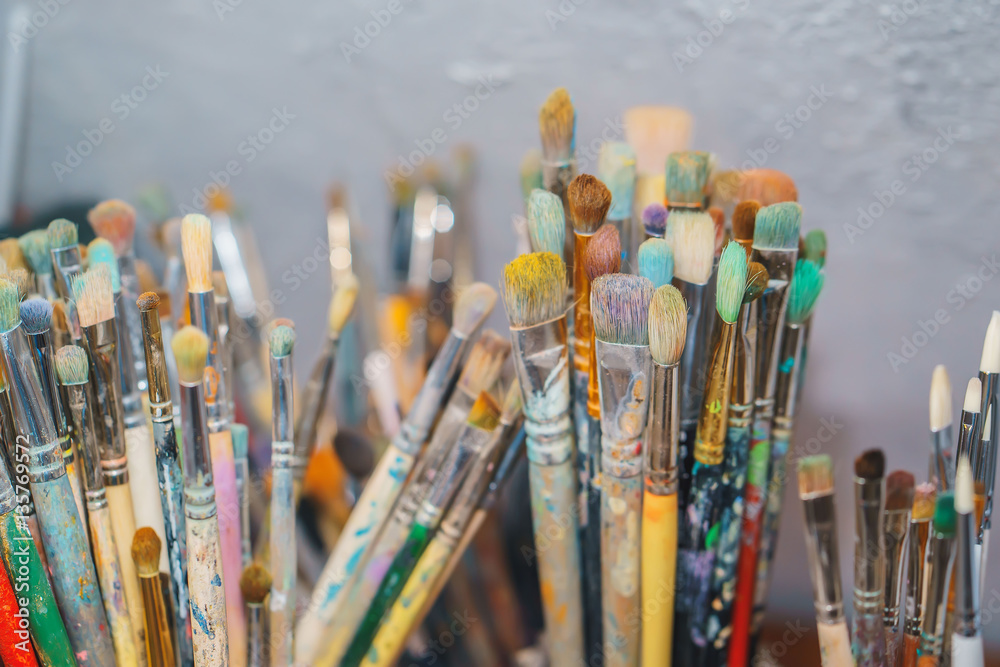 Paint Brushes isolated in grey background, close-up Paint Brushes isolated in grey background, close-up