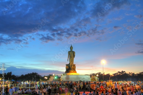 Photography Makha Bucha Day, Unidentified thai people holding lit candle and walk around Big Buddha for Worship on the Holiday  at Phutamonthon Park Thailand
