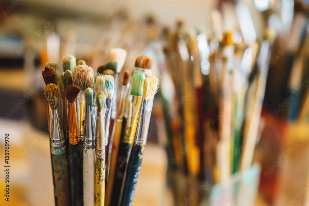 Fototapeta premium Paint Brushes isolated in blur background, close-up