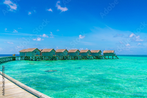 Beautiful water villas in tropical Maldives island .