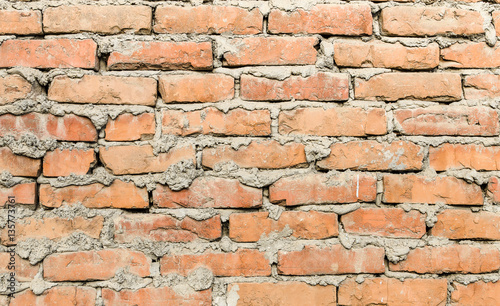 Background brown brick wall close-up