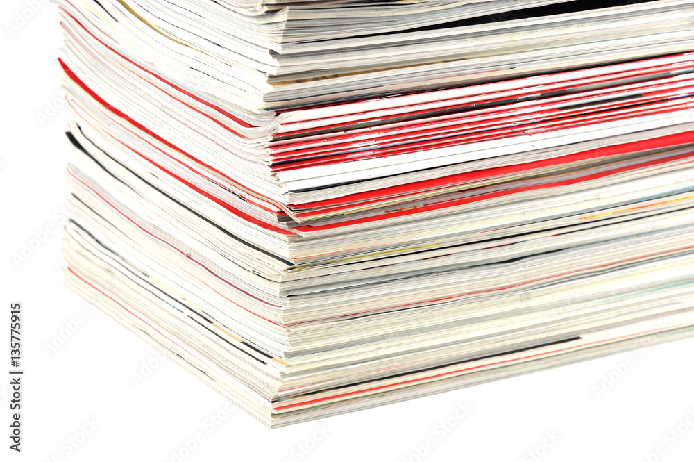 close up on stacking magazines isolated on white background close up on stacking magazines isolated on white background
