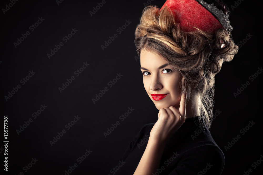 artistic portrait of young girl with beautiful hairstyle in the form roll