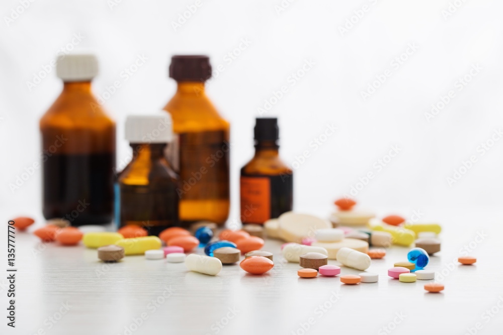 different pills mix on white wooden background different pills mix on white wooden background