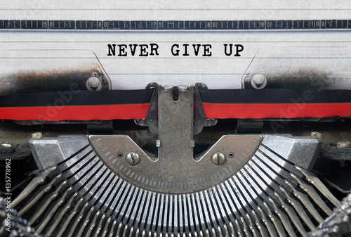 NEVER GIVE UP Typed Words On a Vintage Typewriter Conceptual