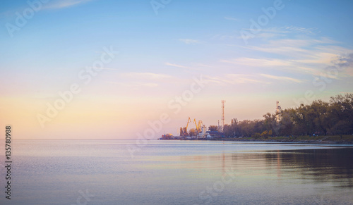 Sky background on sunset, seafront. Nature composition. Panoramic sunset sky background. Taganrog Bay, Azov sea. Beautiful sunset over sea with reflection in water, majestic clouds in the sky. photo