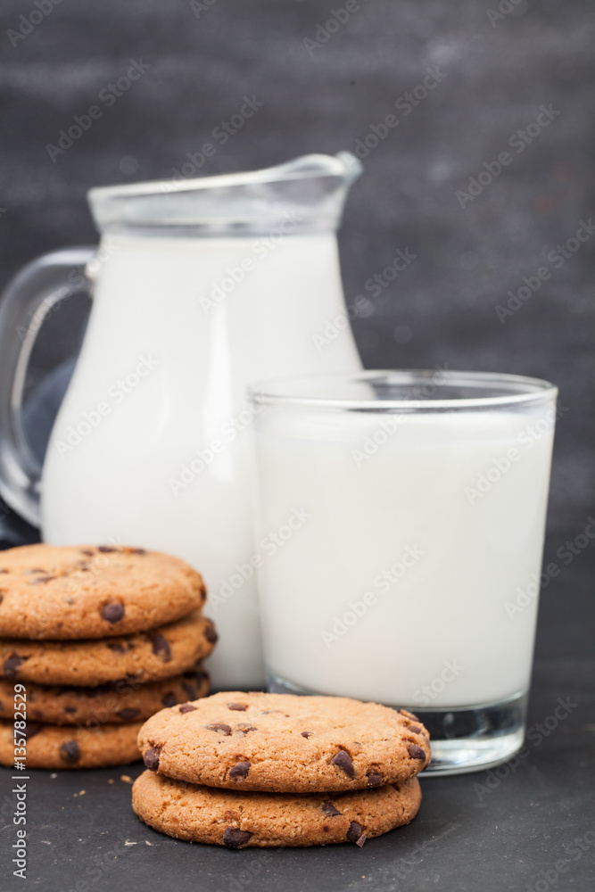 Oatmeal chocolate chip cookies and milk jug. Healthy eating. Oatmeal chocolate chip cookies and milk jug. Healthy eating.