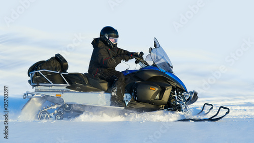 Man on snowmobile. photo