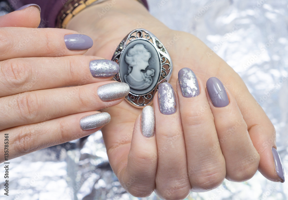 Fototapeta premium Hands and natural nails, ideal clean manicure. Decorated with stylish elements