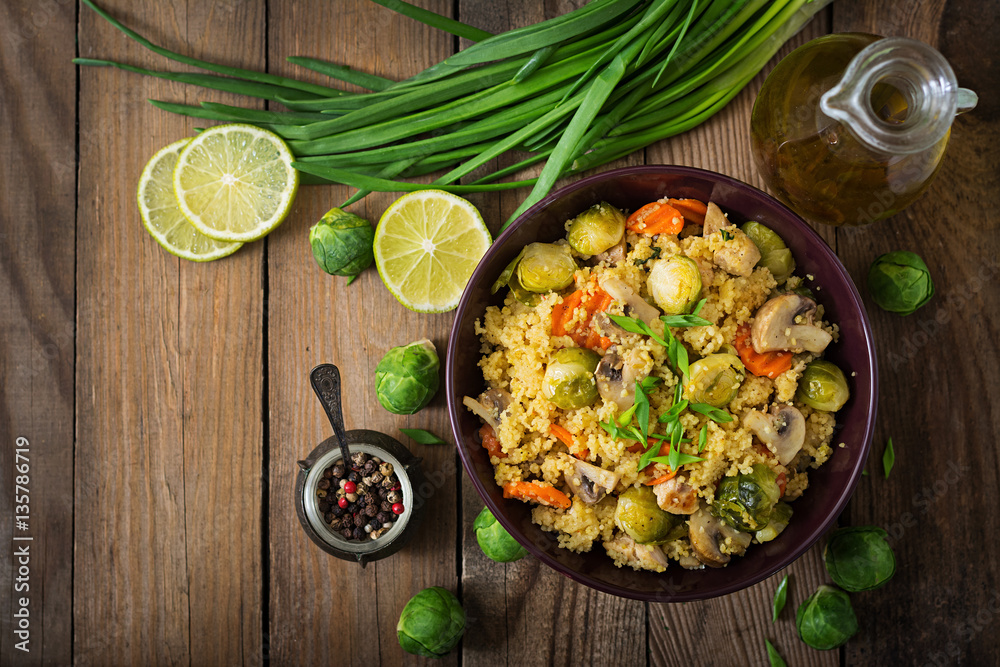 Vegetarian couscous salad with brussels sprouts, mushrooms, carrots and