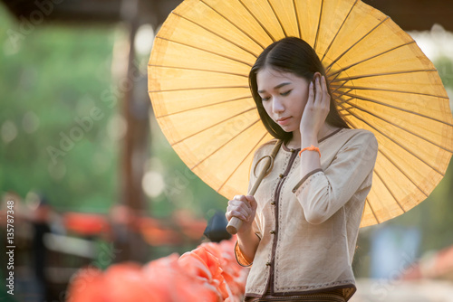 Portrait of Beautiful rural thai woman wear thai dress photo