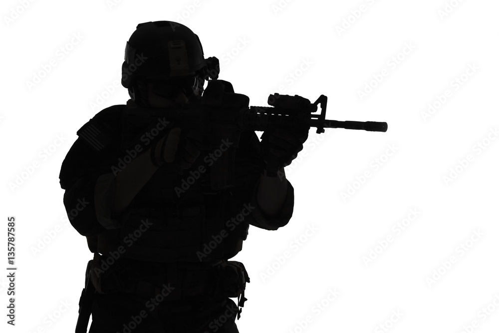 United states Marine Corps special operations command Marsoc raider with weapon aiming a gun. Silhouette of Marine Special Operator white background United states Marine Corps special operations command Marsoc raider with weapon aiming a gun. Silhouette of Marine Special Operator white background