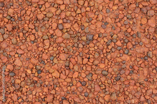 Red laterite gravel texture for background. photo