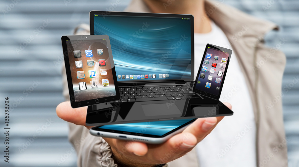 Businessman holding laptop phone and tablet in his hand 3D rende Businessman holding laptop phone and tablet in his hand 3D rende