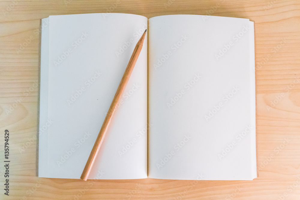 White Notebook paper put on the table. White Notebook paper put on the table.