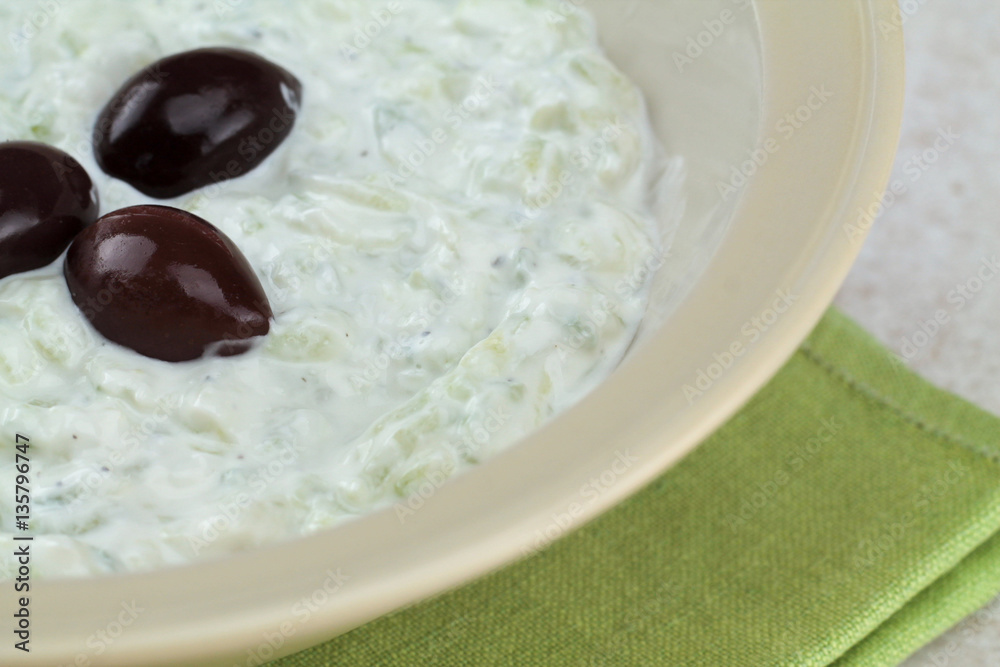 Tzatziki sauce in bowl, close up