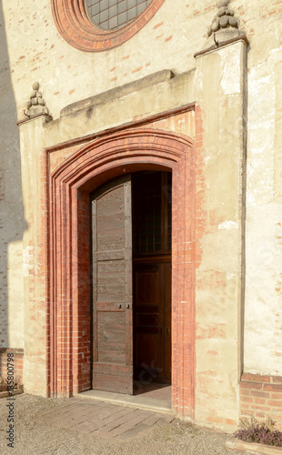 entrance portal of church at Mirasole abbey, Milan, Italy