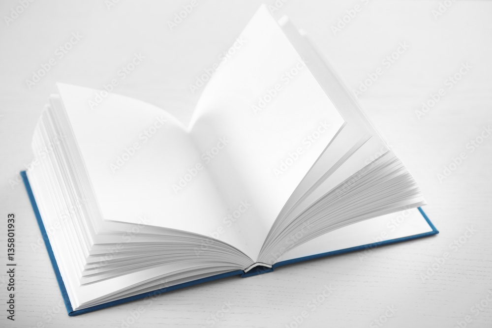 Fototapeta premium Opened book on table, closeup