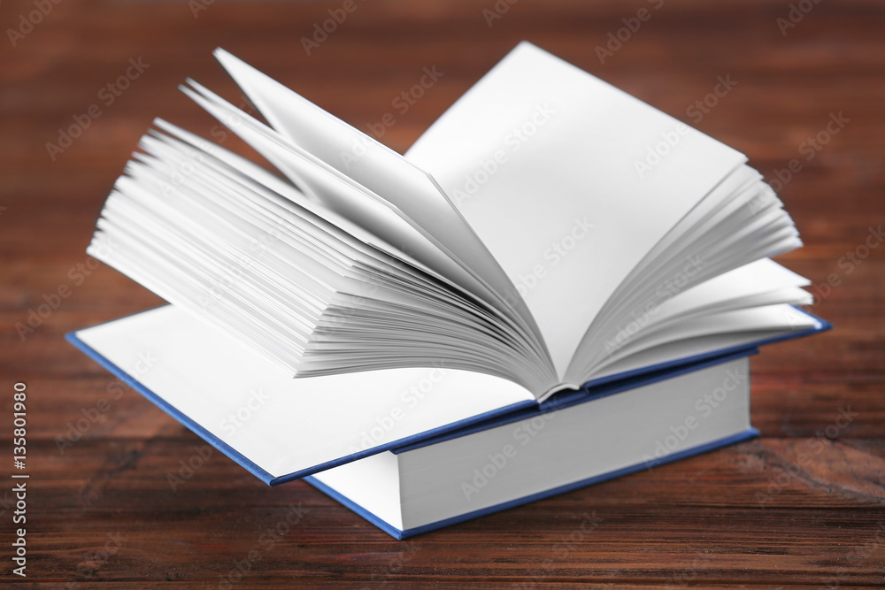 Closeup view of books on wooden background Closeup view of books on wooden background