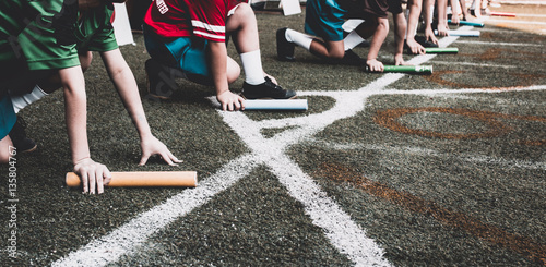 Students boy prepare to leaving the starting for relay race boy at school sports day. School sports day concept with photo effect.
