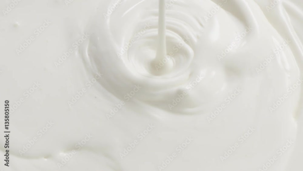 Slow motion of cream or yogurt pouring, 180fps prores footage Slow motion of cream or yogurt pouring, 180fps prores footage