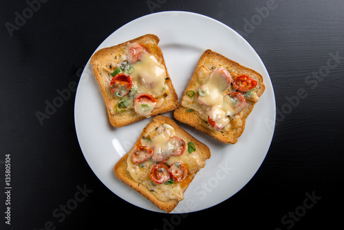 Grilled toast with camembert and cherry tomatoes