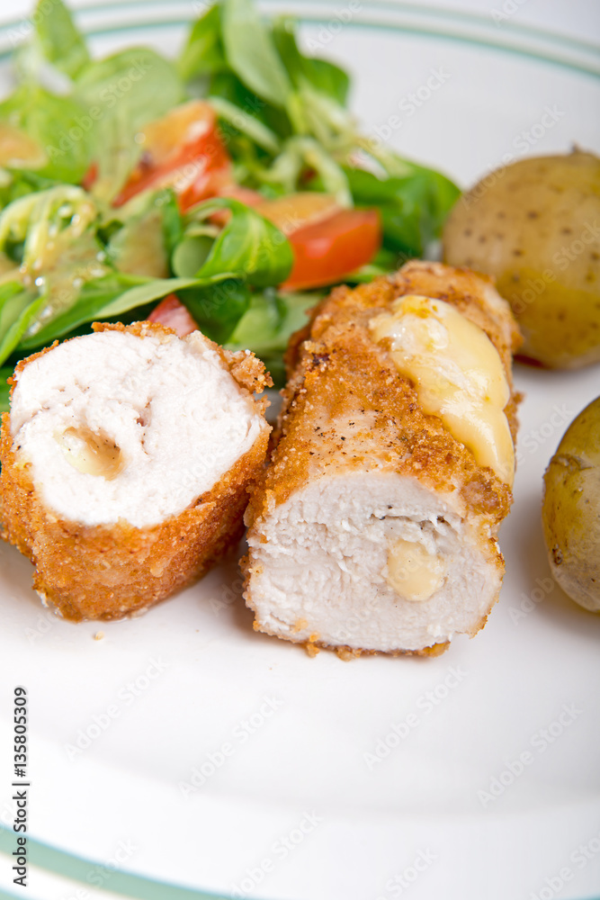 Kiev cutlet with jacket potatoes and salad Kiev cutlet with jacket potatoes and salad
