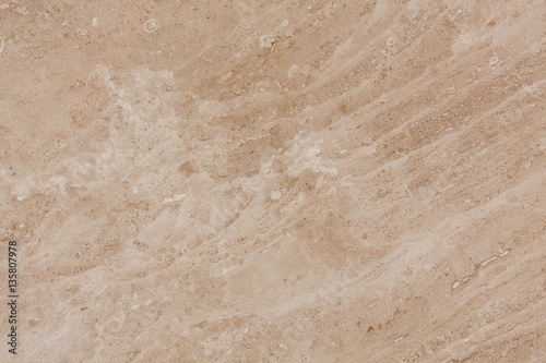 Seamless beige marble stone tile texture.