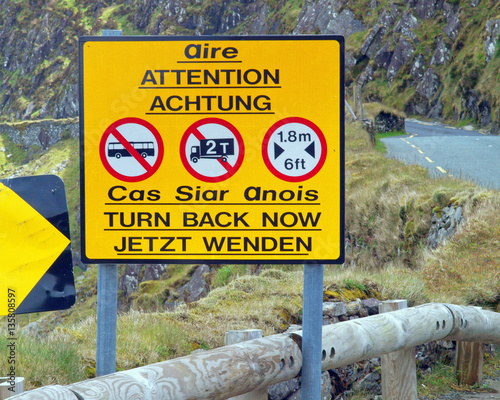 Road warning sign on the Conor Pass in the Dingle Peninsula, the highest mountain road in Ireland