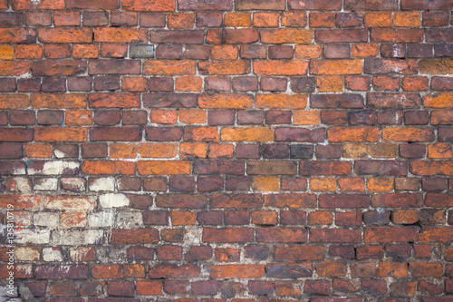 red brick wall, urban exterior, ancient weathered surface