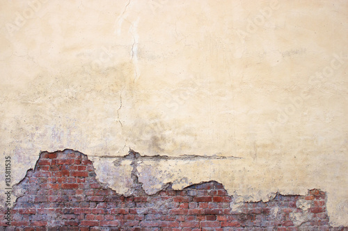 Old brick wall with peeling...