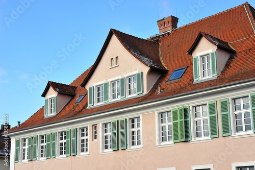 Renovated House-Front with Dormer Windows (Gauben) at tiled Roof (Ziegeldach)