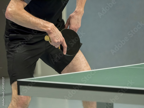 table tennis player waiting for the ball, focus at the blade