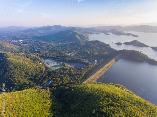 Aerial view of Dam and green mountain at dusk