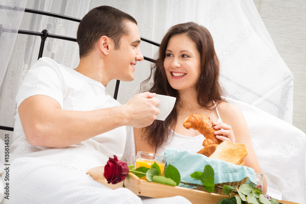 Couple Having Breakfast In Bed