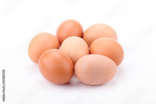 Brown eggs isolated on white background.