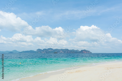 Touring boat landed on the white tropical beach of Poda island, Krabi,Thailand.