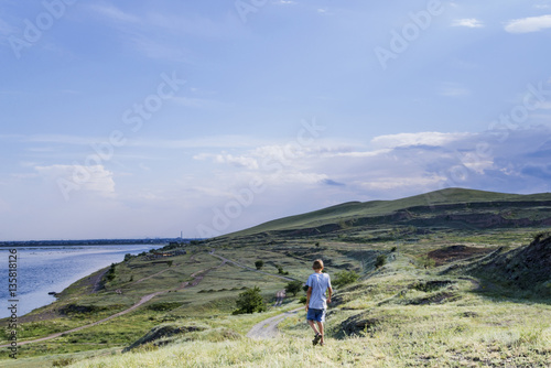 the young man goes on a mountain track © Shchaeva Liudmila