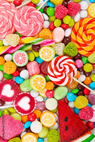 Colorful lollipops and candy. Top view.