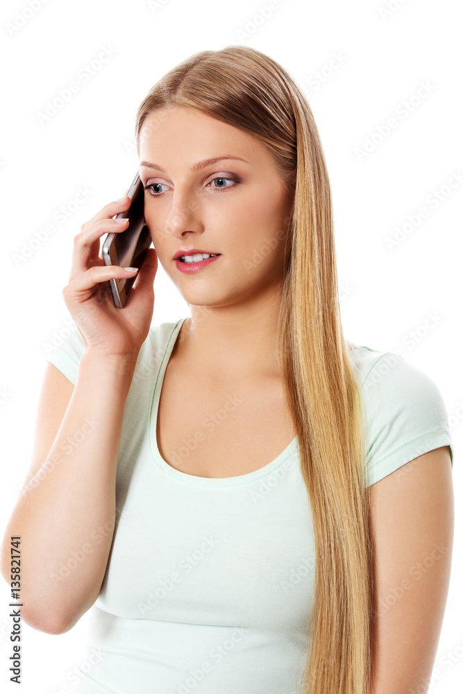 Attractive young woman making a phone call. Attractive young woman making a phone call.