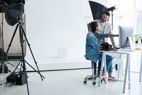 Photography Photographers working together over computer