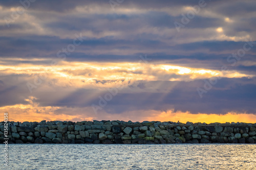 Breakwater and dramatic sky at Lista in southern Norway photo