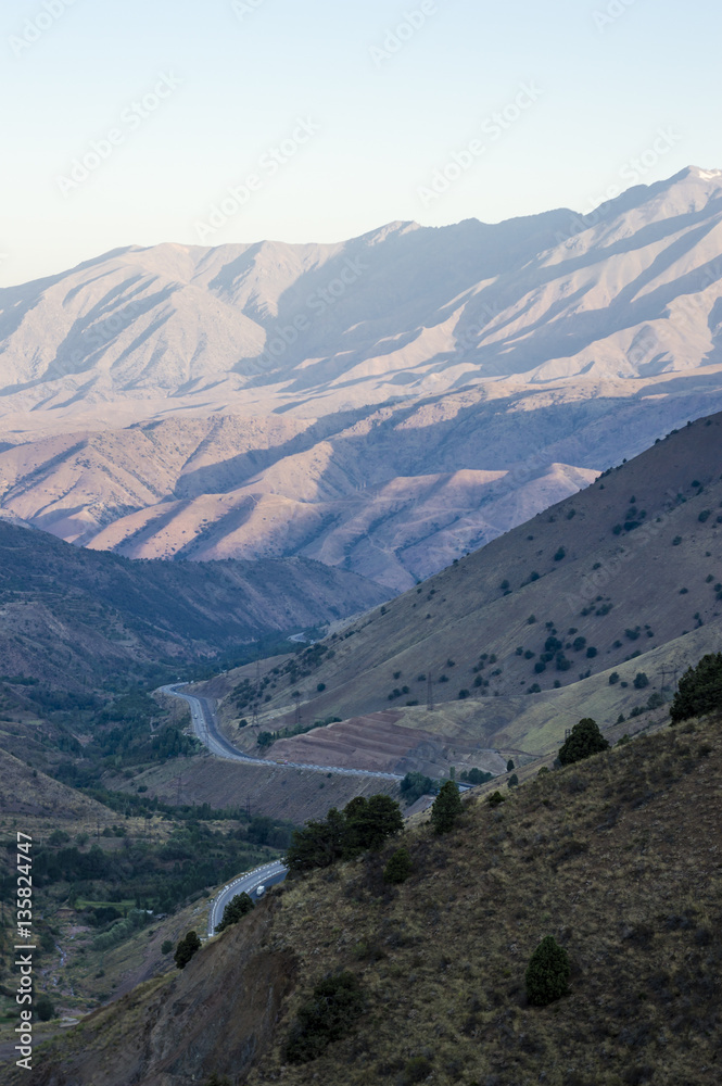 Tian Shan mountains and road view from Kamchik mountain Pass in Uzbekistan