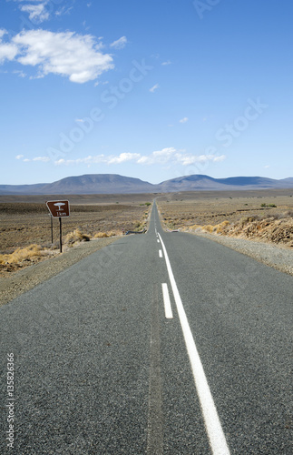 Highway passing through the Central Karoo region of South Africa near Matjiesfontein looking toward the Komsberge Mountains © petert2