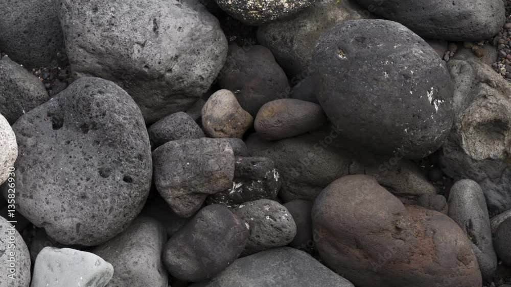 Black stones on a Black sand beach as a background
Black stones on a Black sand beach as a background