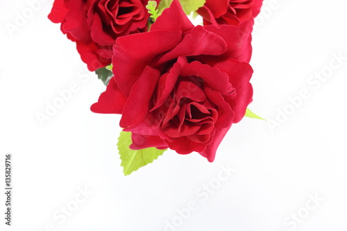 A beautiful  bouquet of artificial red roses on white isolated with copy space background. Love and romance concept.