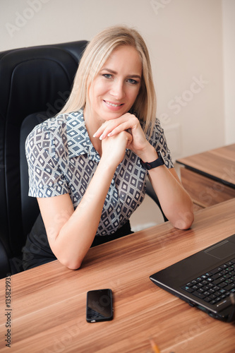 Beautiful business woman working with sales in her office