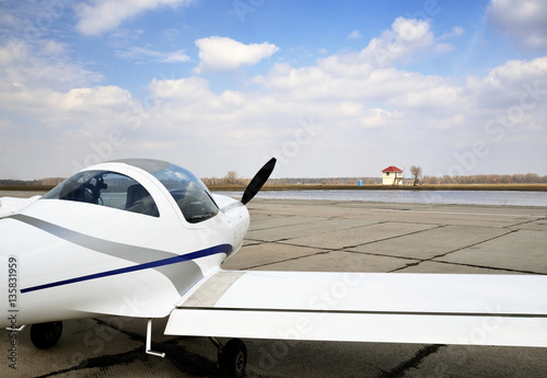 Fotografija A modern light aircraft on the airfield